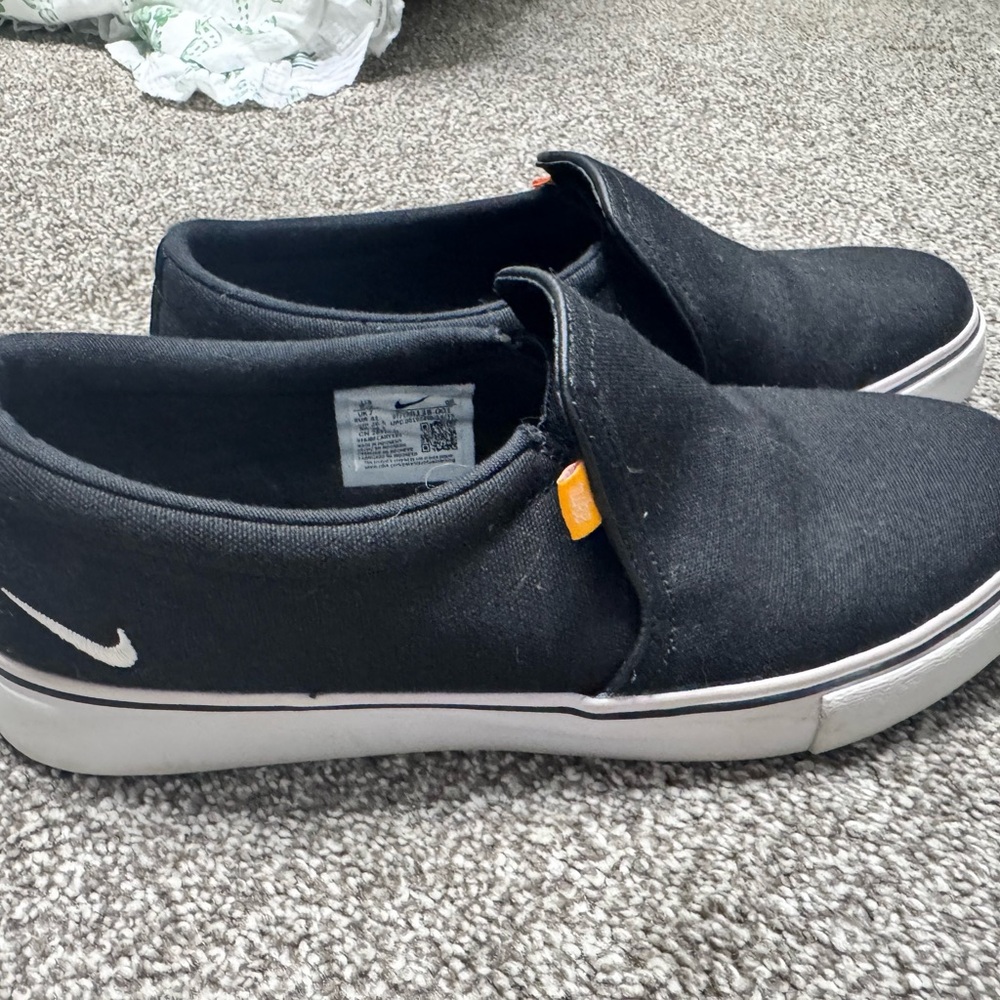 Nike womans Black Slip-On Canvas with White Sole